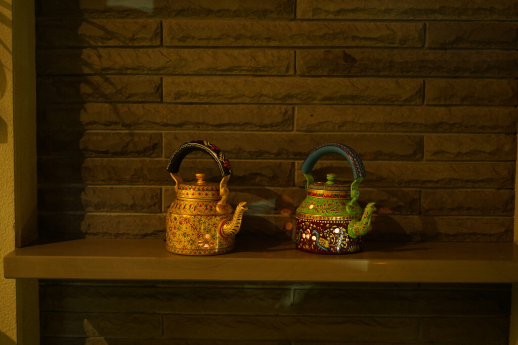 “Handicraft kettle showcasing traditional Indian craftsmanship and artistic metalwork.”